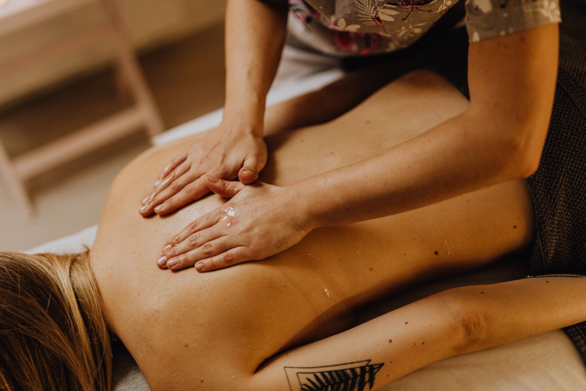 Warm oil being worked into the back during a massage, Sea Med Spa Kharghar