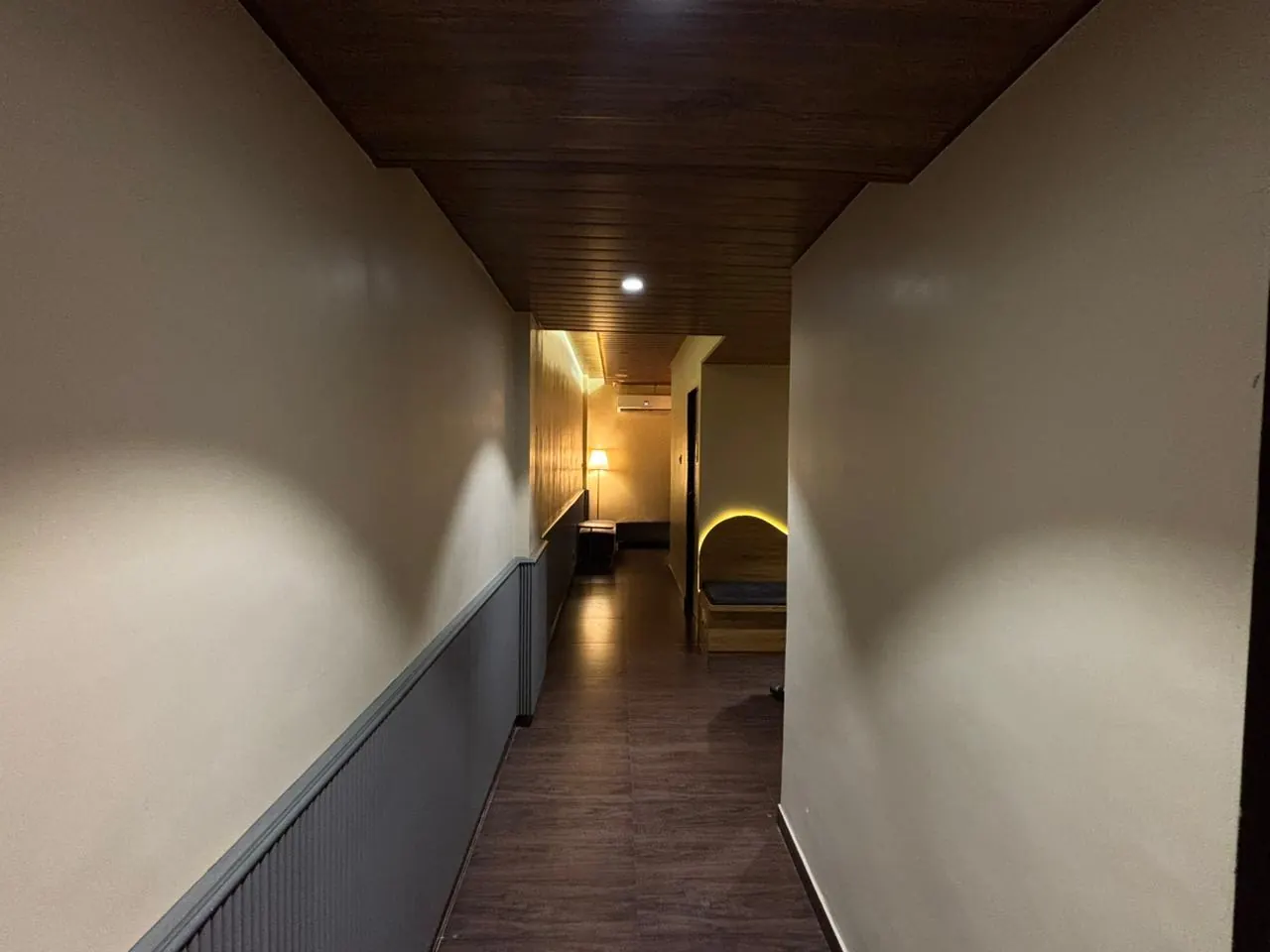 The arch-lit corridor leading to the Sector 7 treatment rooms