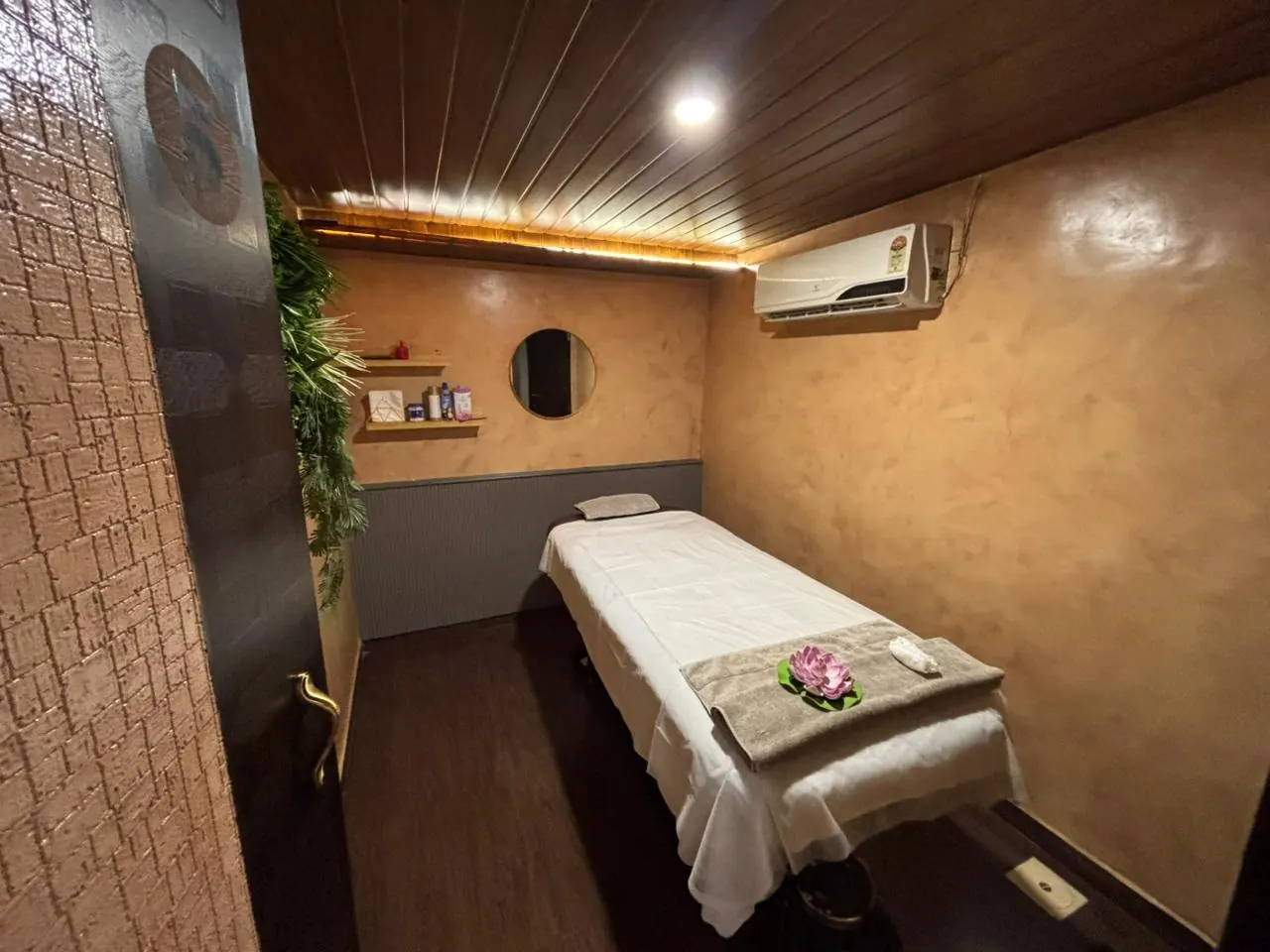 A Sector 7 treatment room, bed dressed with a lotus flower